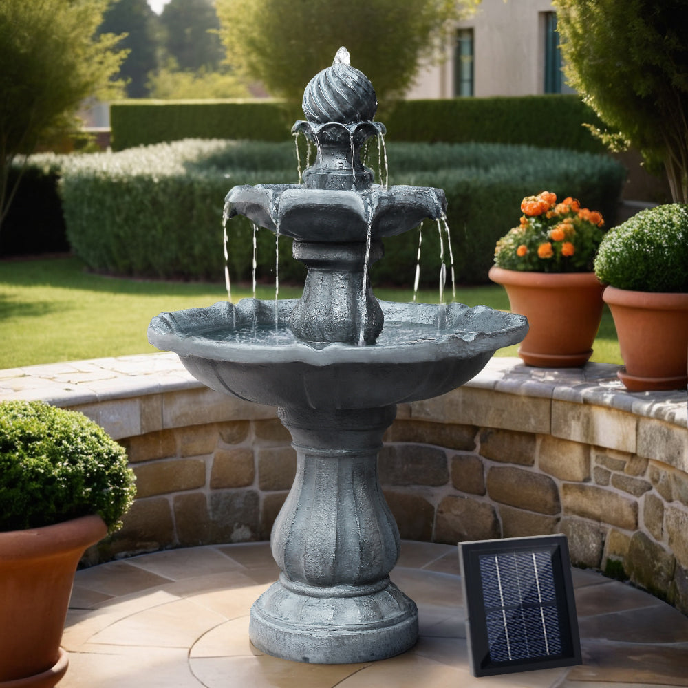 Solar bird bath fountain with three-tier basin, dark gray resin, water flowing from top