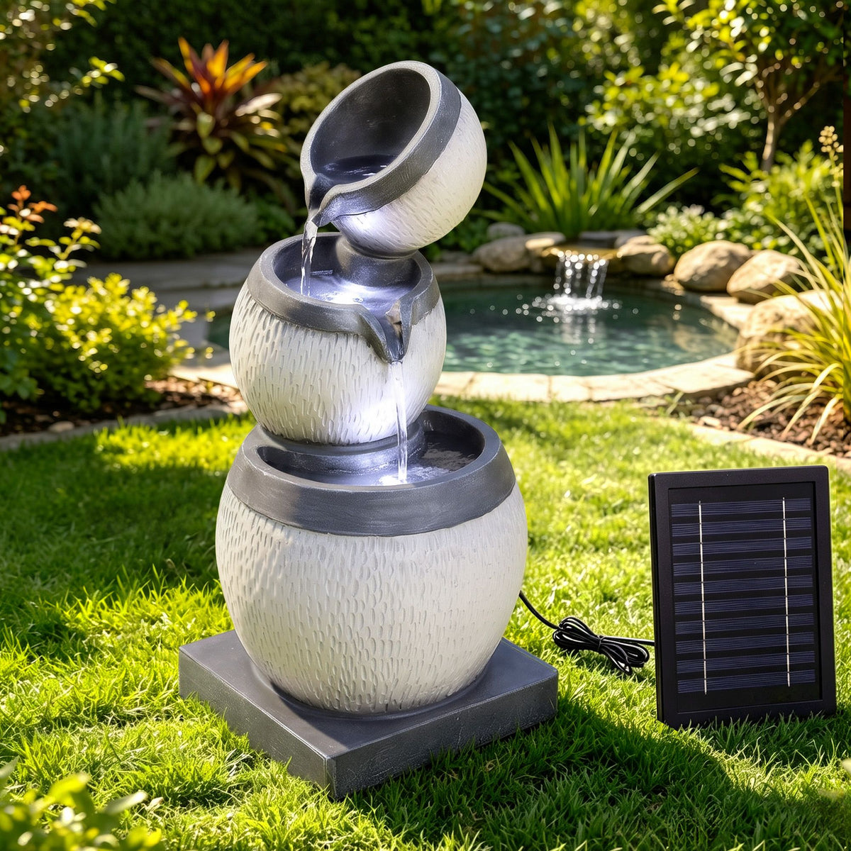 Grey three-tier cascading water fountain with solar panel, stone-texture bowls and top spout.