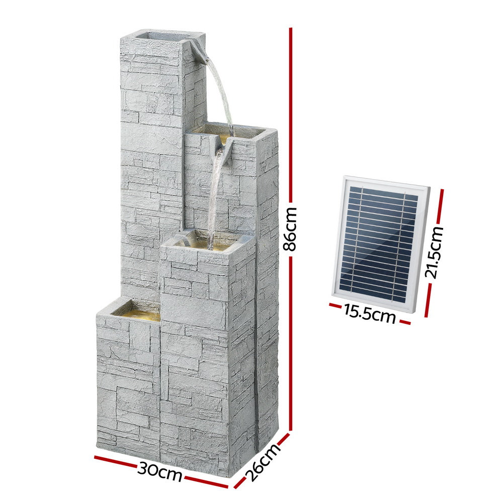 Outdoor water fountain with stone design and solar panel, shown with dimensions.