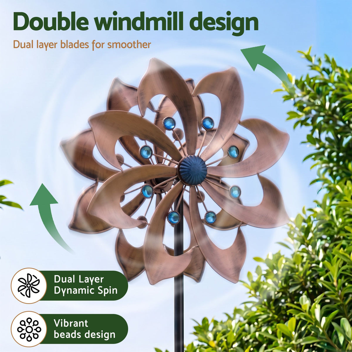 Bronze double windmill spinner with layered blades and blue bead accents on stake