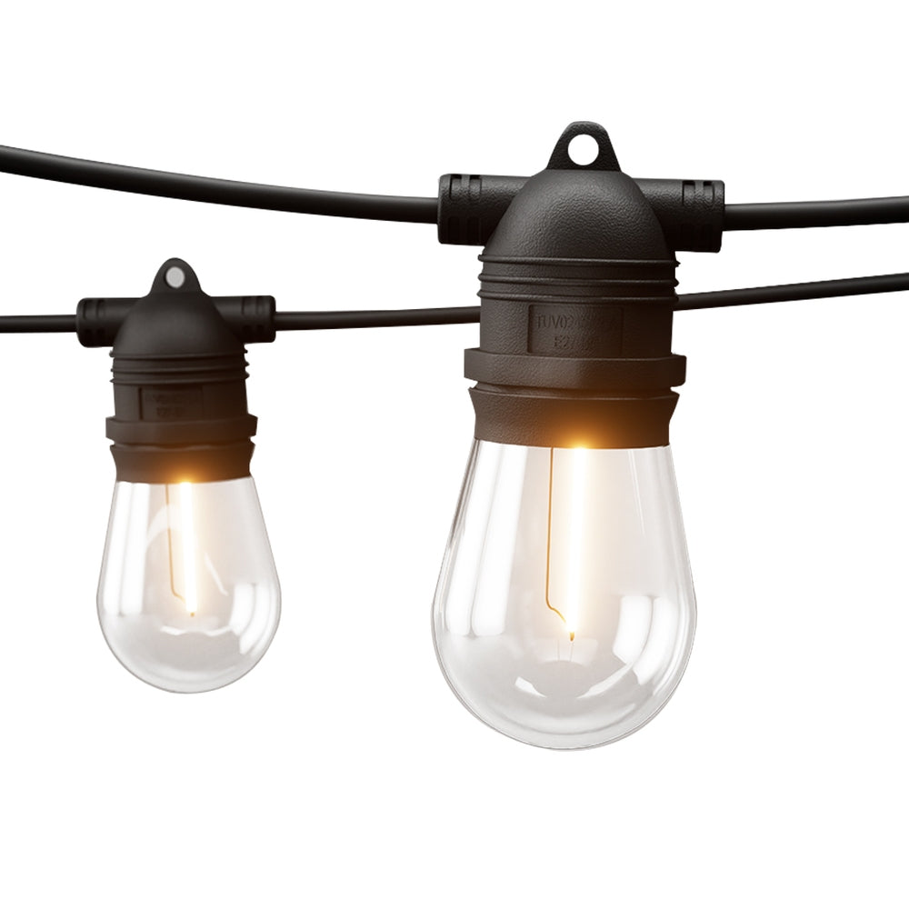 Outdoor string lights with warm-glow vintage bulbs and black socket caps on two cords