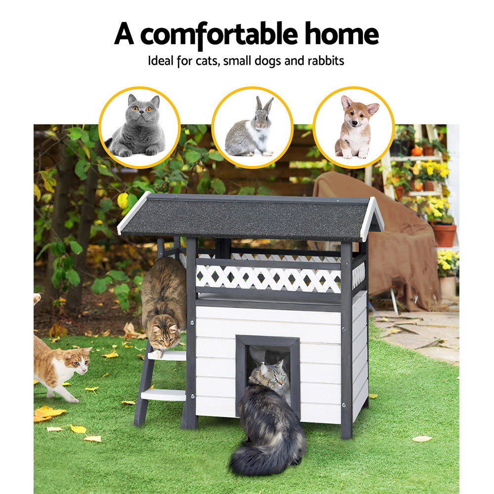 Outdoor cat house shelter with front mesh entry, white panels, dark roof and raised platform