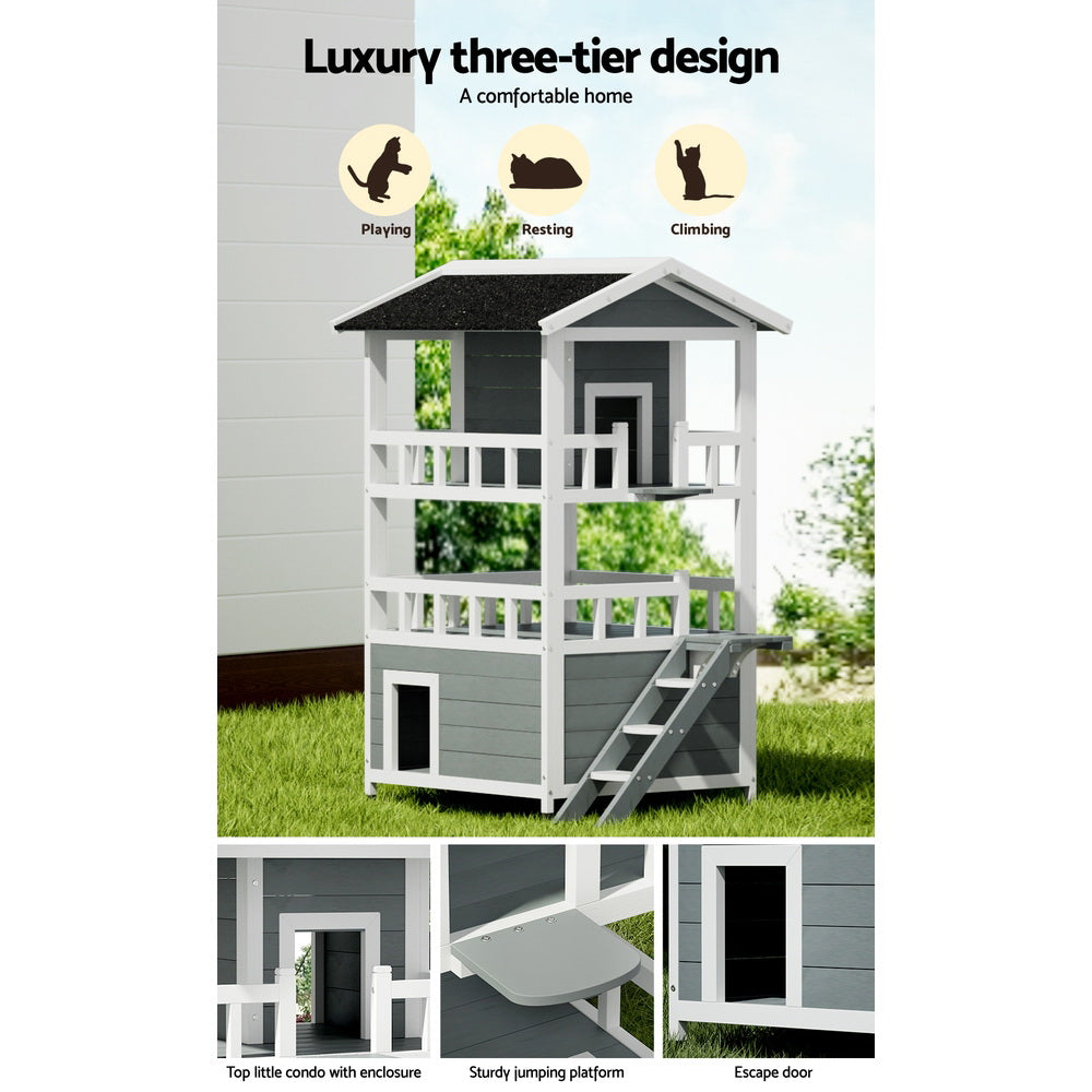 Two-story outdoor cat house with ramp stairs, enclosed doors, and black roof