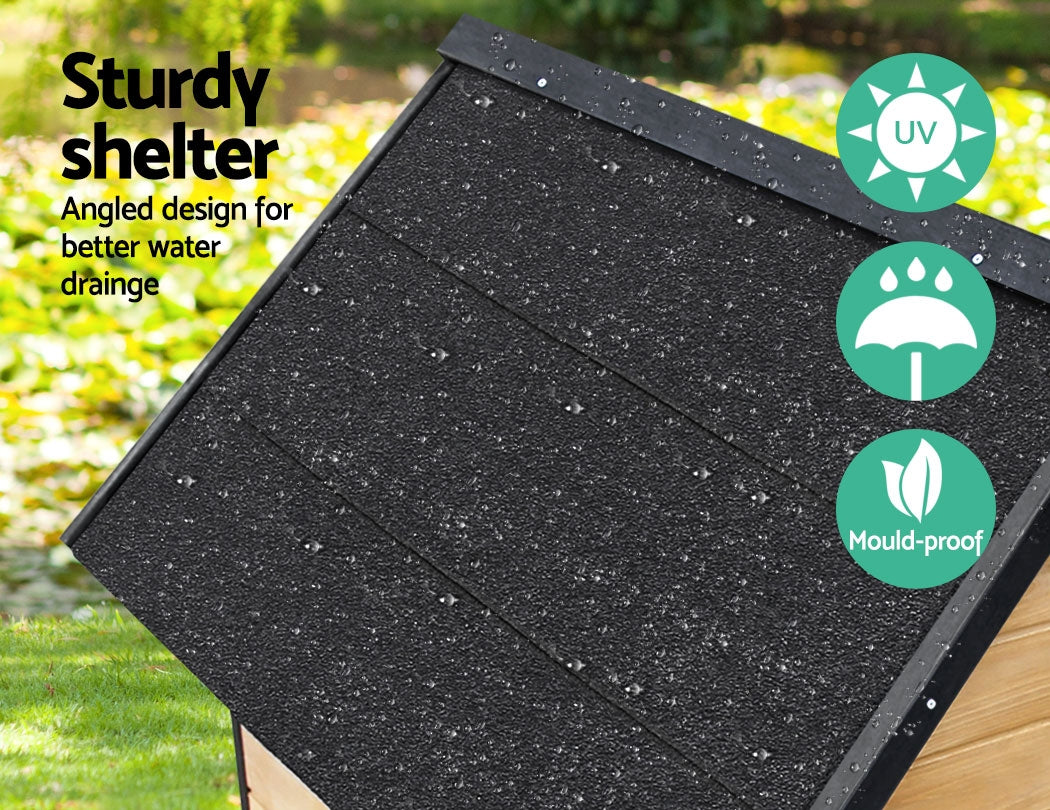 Angled black shingle roof on extra large wooden outdoor dog kennel