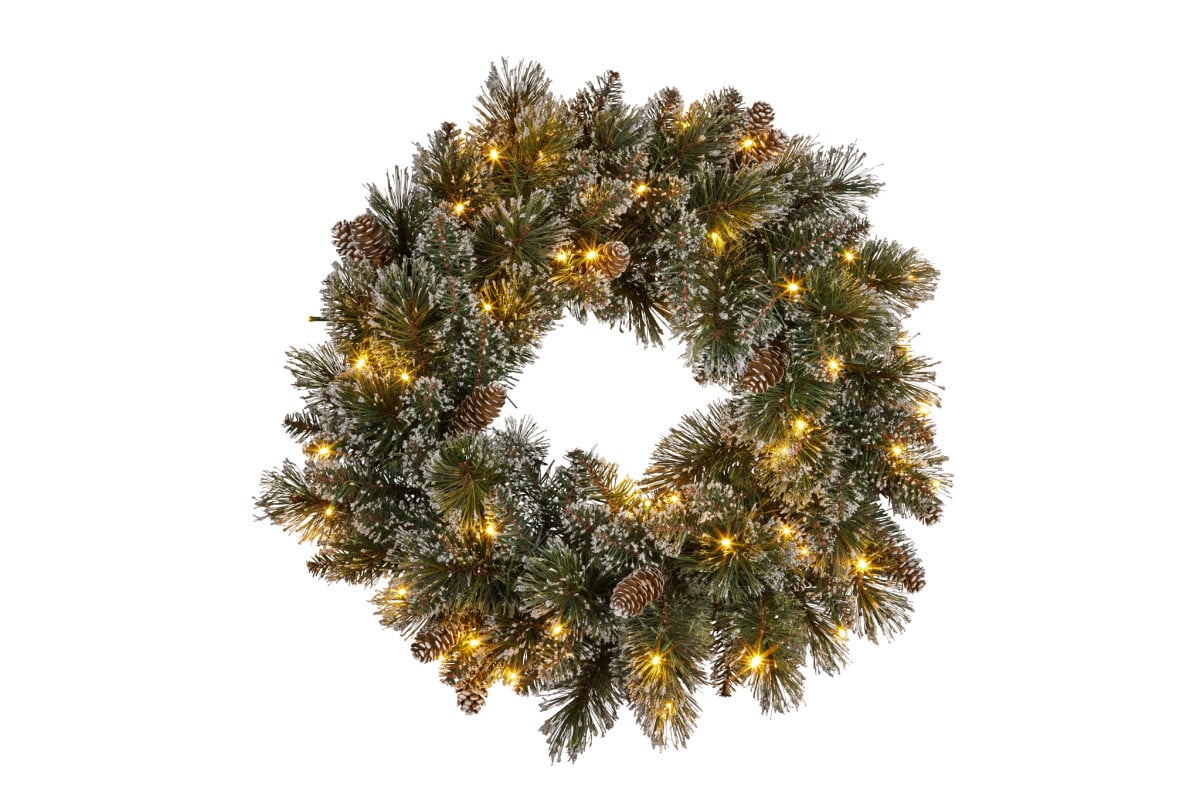 Christmas pine wreath with warm LED lights and pinecones for front door decor