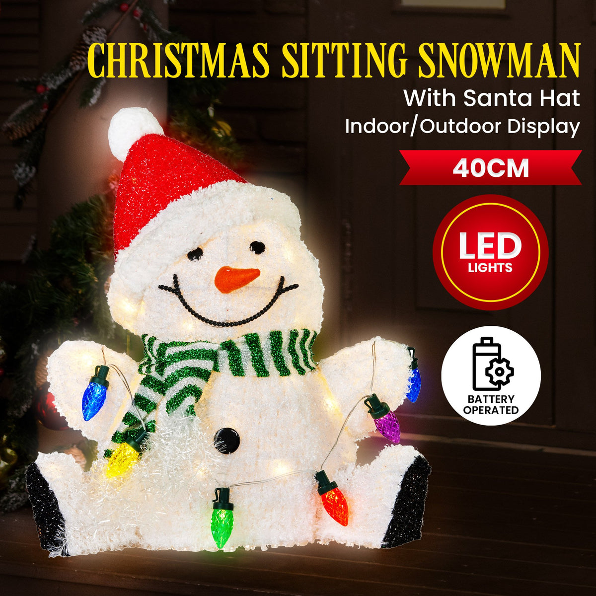 Sitting snowman decoration with Santa hat, green striped scarf, and 40cm multicolor LED lights.