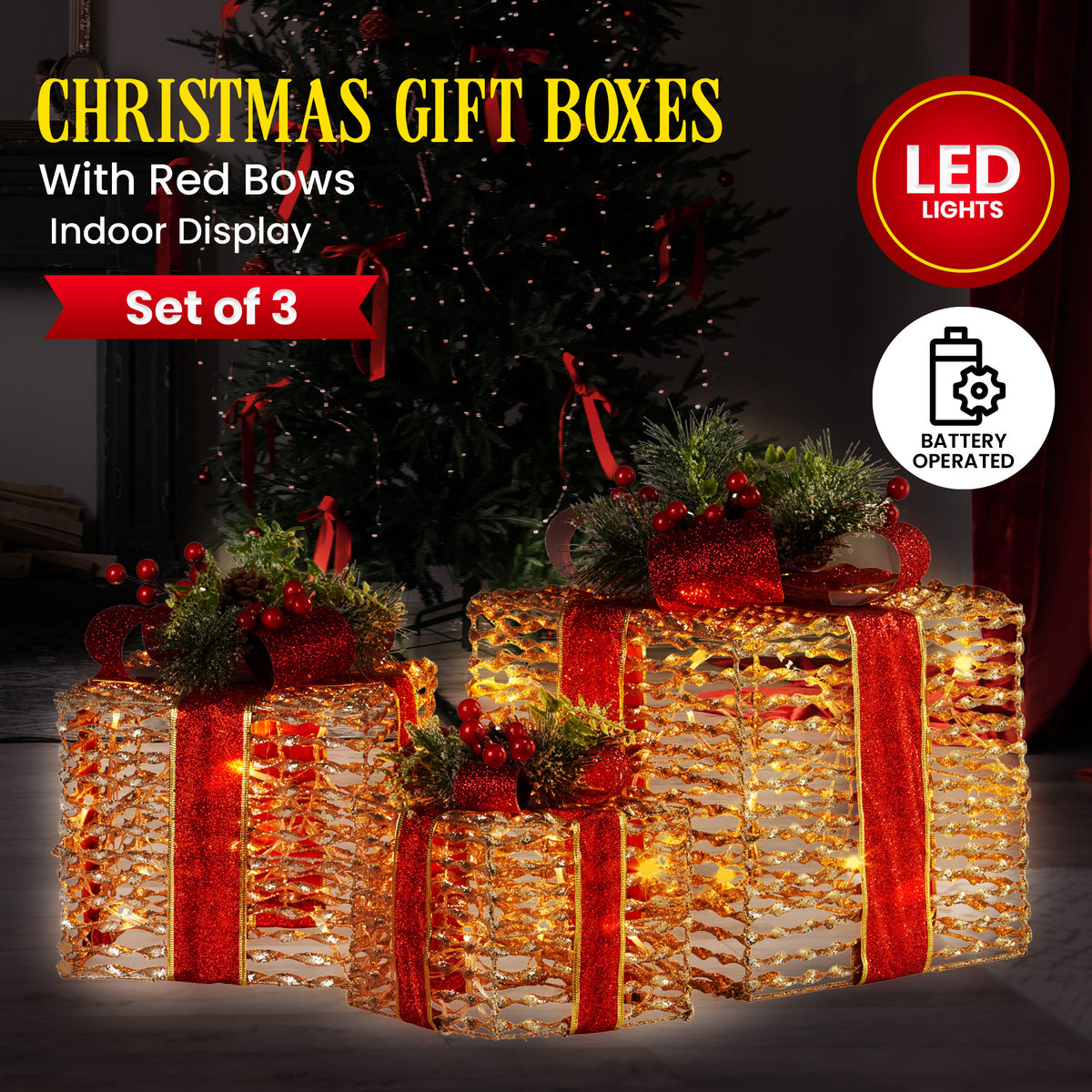 Set of three lit Christmas gift boxes with gold foil, red bows, and evergreen accents
