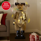 Plush LED moose ornament with scarf and lantern, warm yellow lights shining