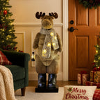 Plush LED moose ornament with scarf and lantern, warm yellow light glowing