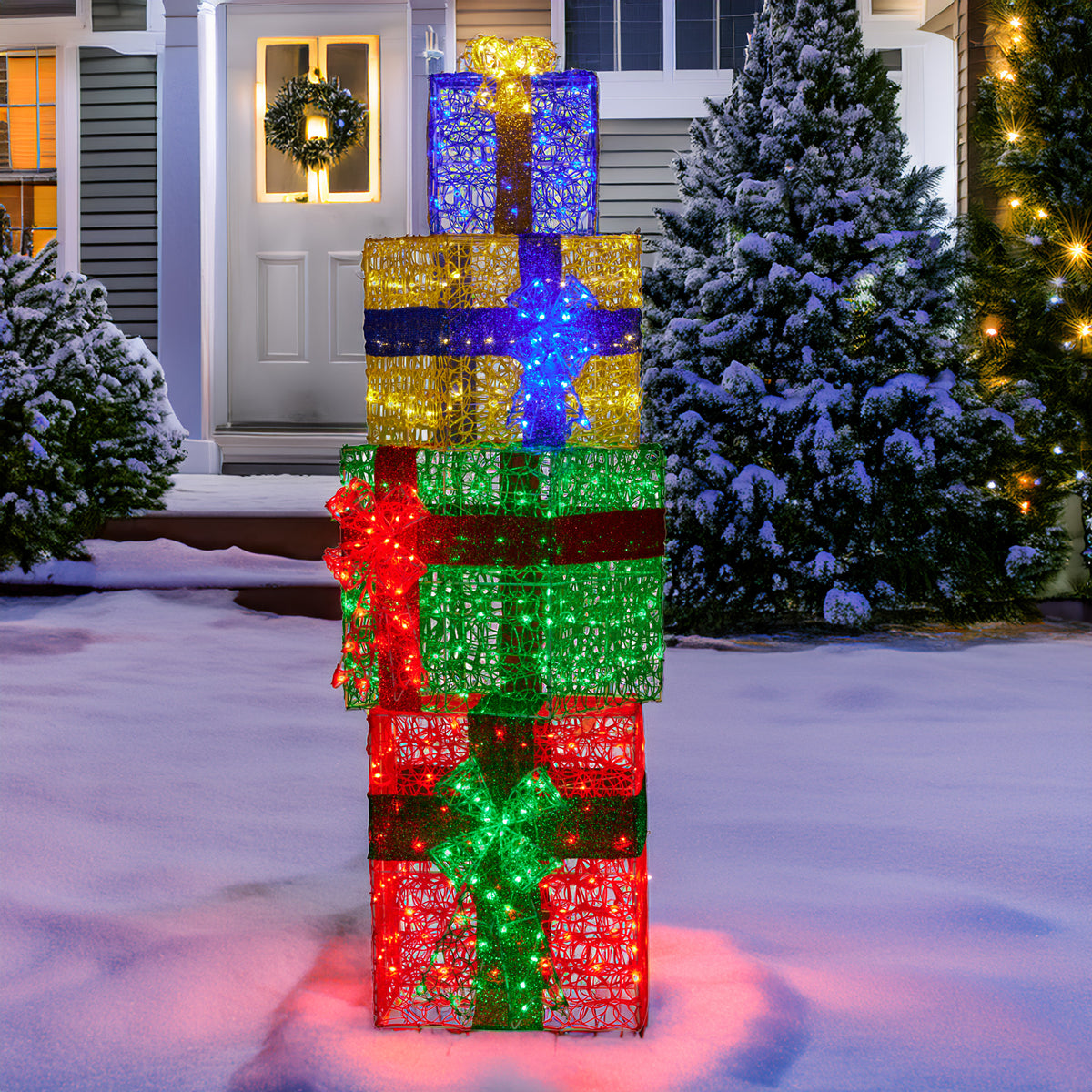 Glowing multicolor LED gift stack decoration with red, green, blue, and gold bow layers