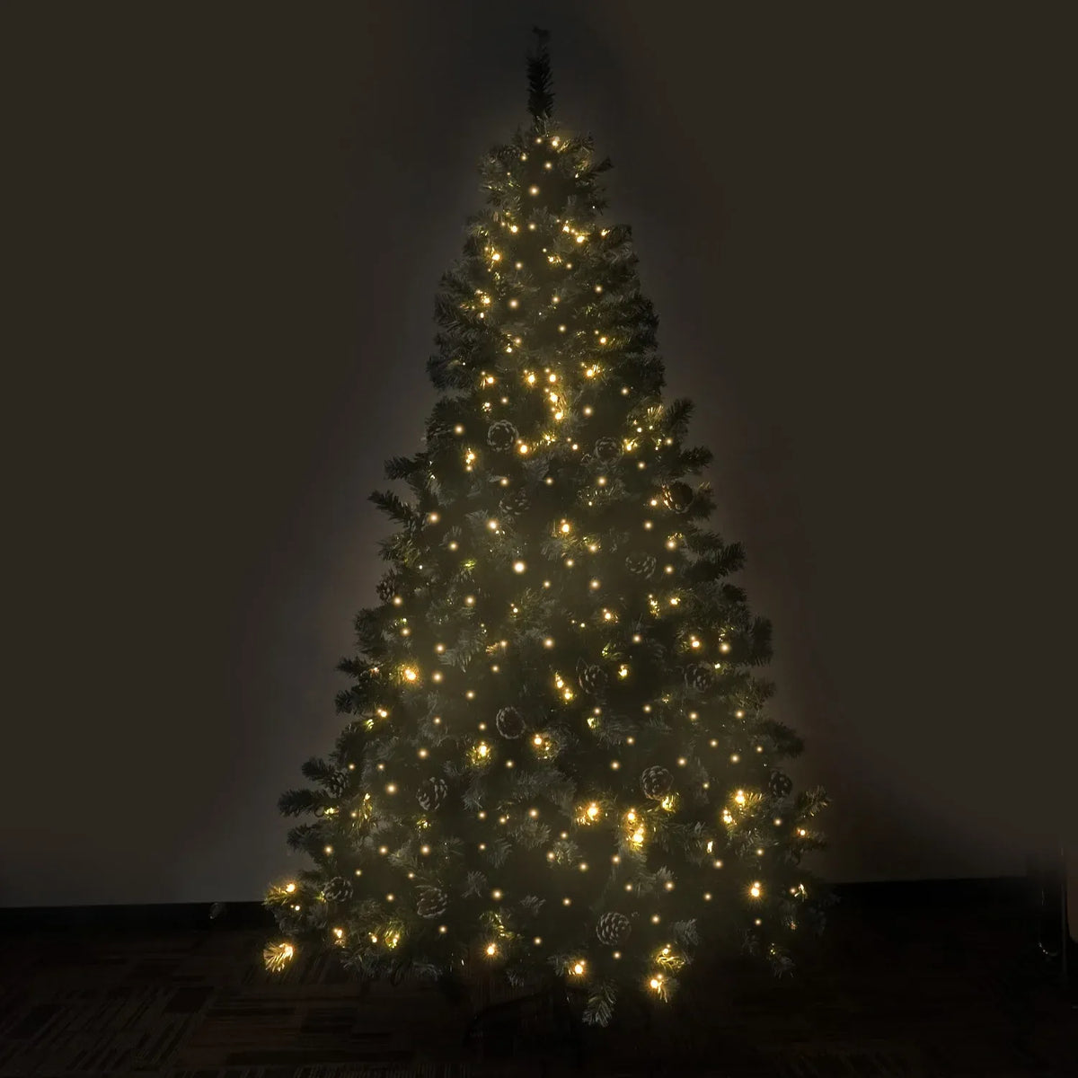 Tall pre-lit artificial Christmas tree glowing with warm white LED lights