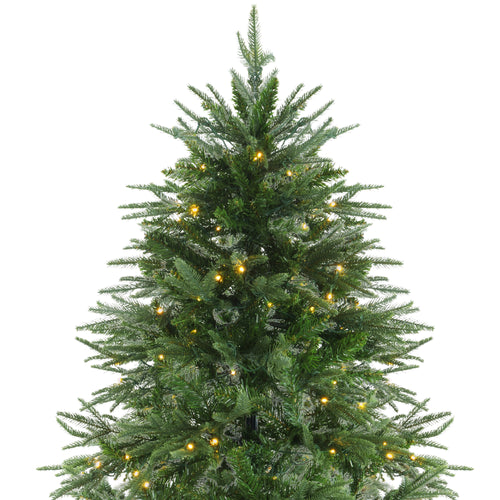 Artificial Christmas tree with warm glowing LED lights on green branches