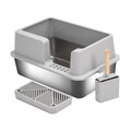 Grey multi-compartment cat litter box with side scoop, grate tray, and small bin