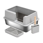 Grey multi-compartment cat litter box with side scoop, grate tray, and small bin