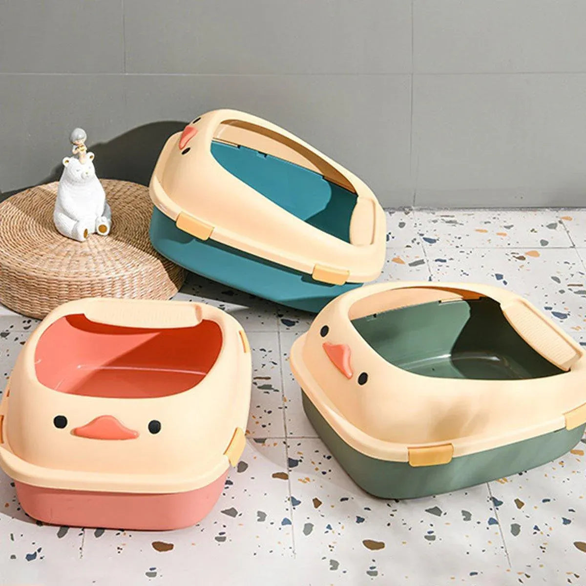 Semi-enclosed cat litter box set, cream lids and teal bases, one lid open