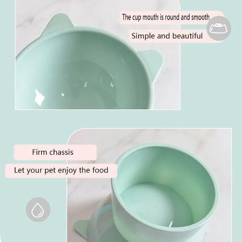 Light blue elevated tilted pet bowl with smooth round rim and side handle nubs