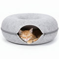 Cat Tunnel Bed with cats inside, on a light background

