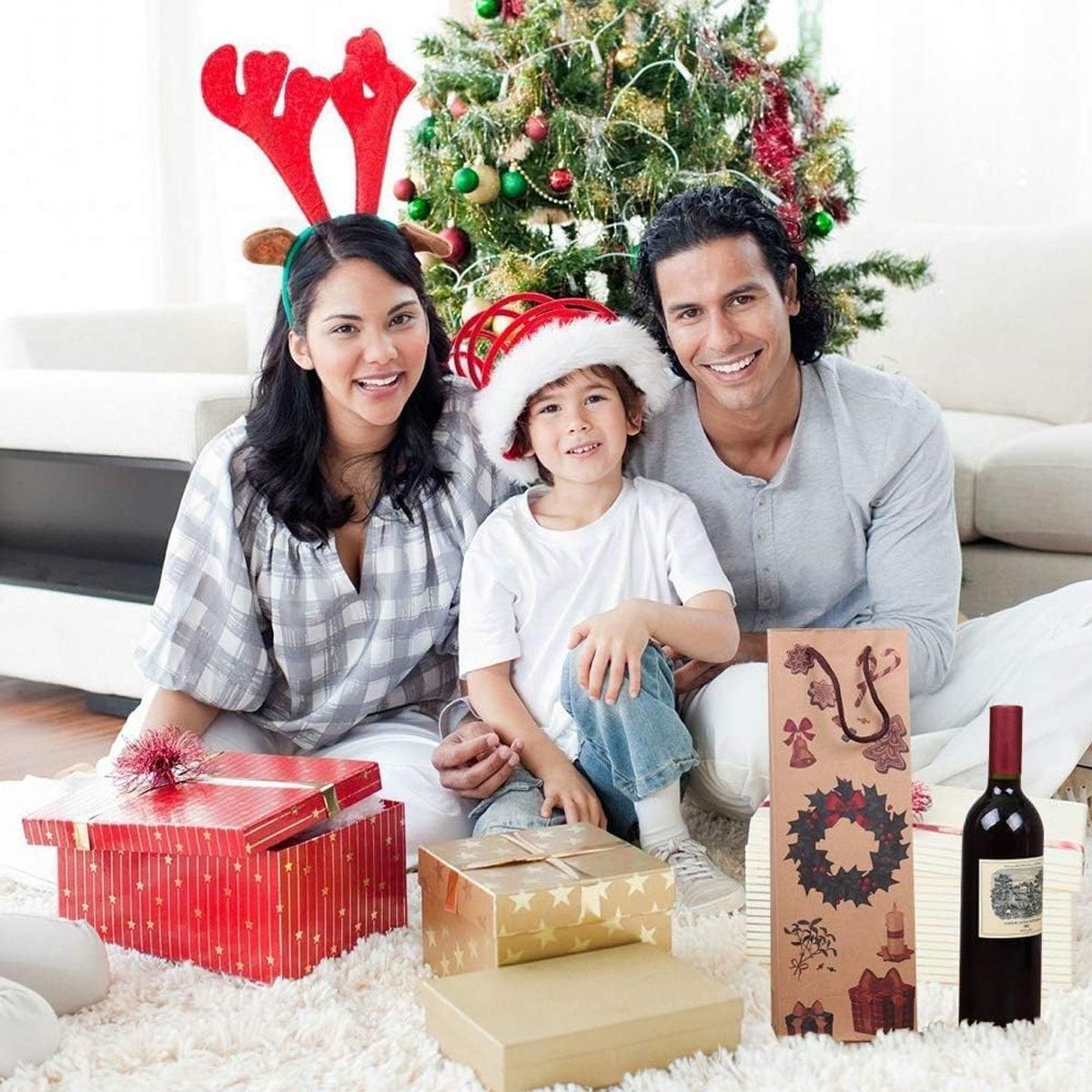 Kraft paper Christmas wine bottle gift bag with holiday figure print on display