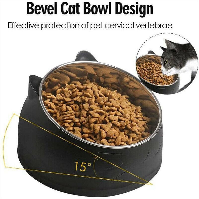 Black tilted pet food bowl holding dry kibble in stainless steel insert