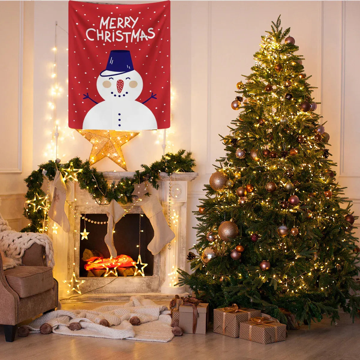 A festive Christmas scene in a living room with a decorated Christmas tree, fireplace, stockings, and a red wall hanging that says “Merry Christmas” with a snowman illustration. Several wrapped gift boxes sit at the base of the tree.