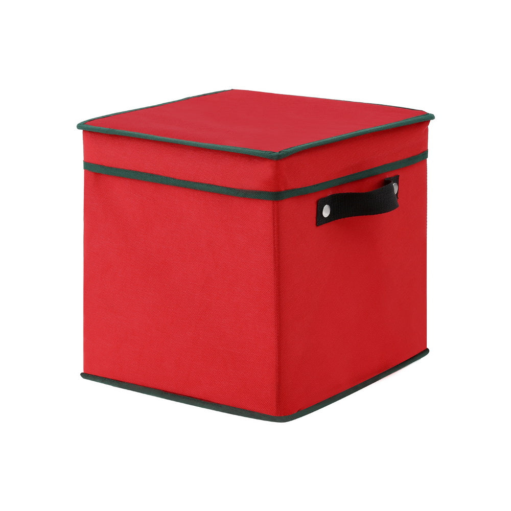 Red fabric ornament storage box with flat lid and black handle on the side