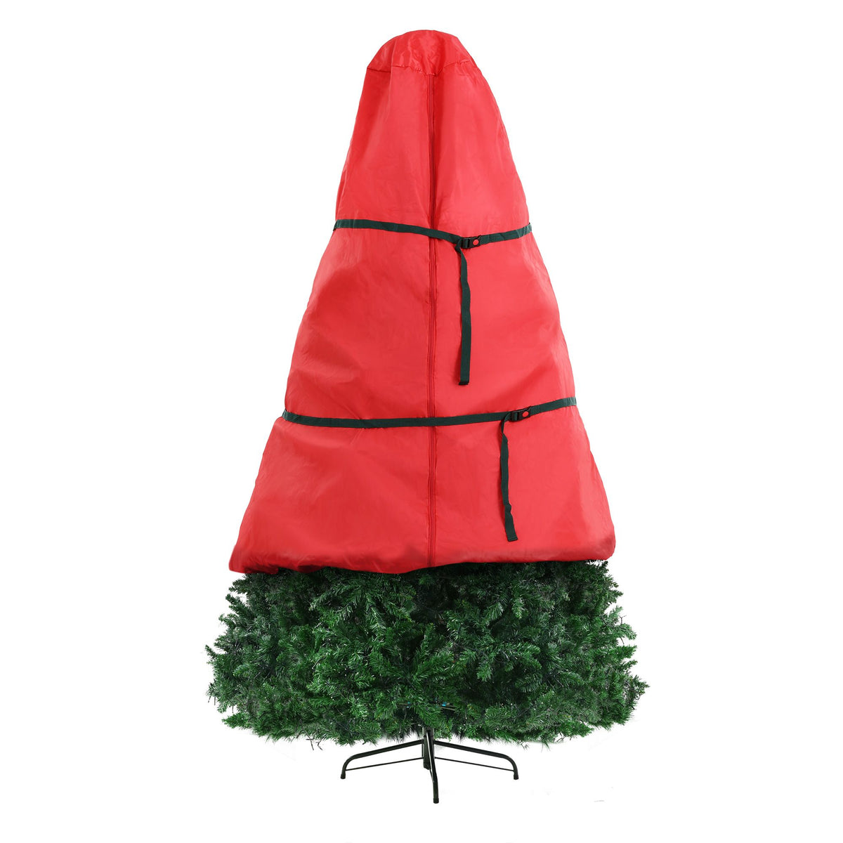 Green artificial Christmas tree emerging from red storage bag with black straps