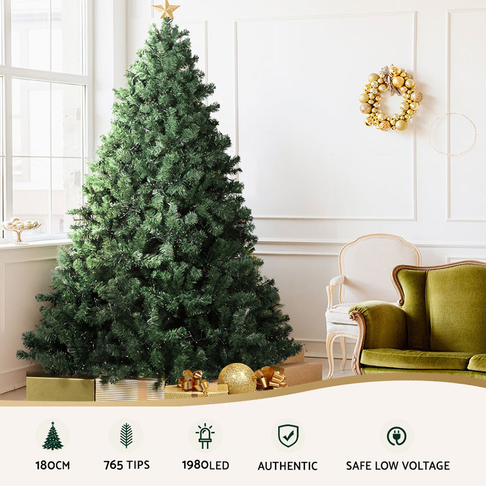 Pre-lit Christmas tree with green branches and warm white LED lights