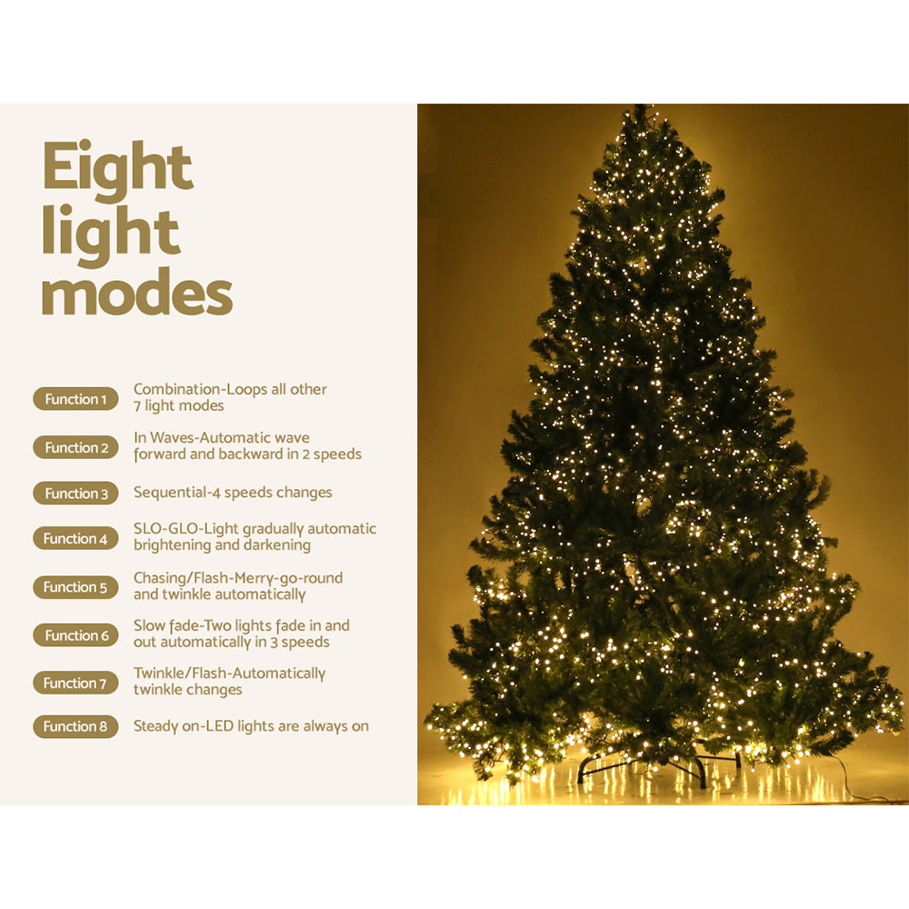 Pre-lit Christmas tree with warm white LED lights glowing