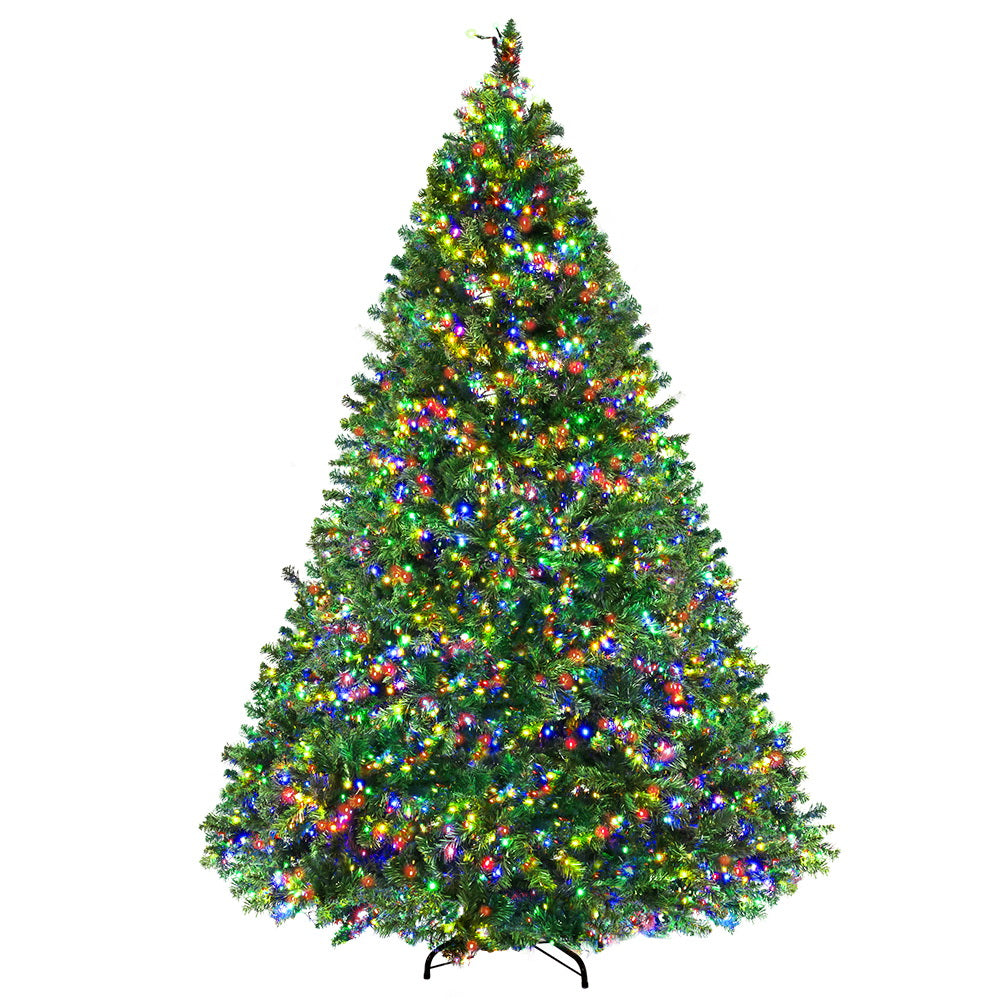 Artificial Christmas tree with dense branches and multicolor LED lights, full view