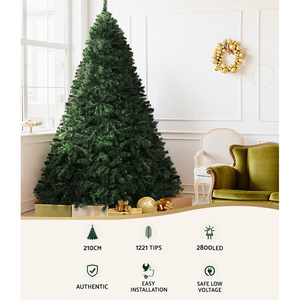 Artificial Christmas tree with multicolor LED lights and base stand, 210cm height shown