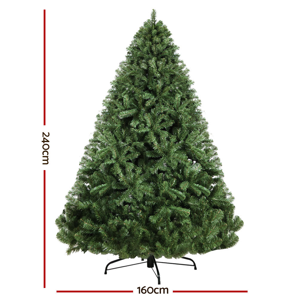 Green artificial Christmas tree with measurements on a white background