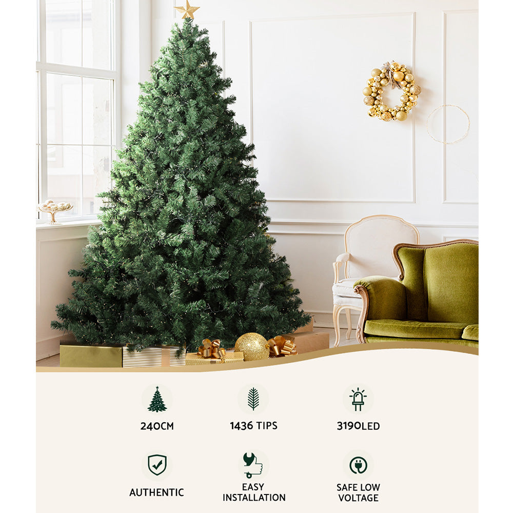 Artificial green Christmas tree with warm white LED lights and full branches
