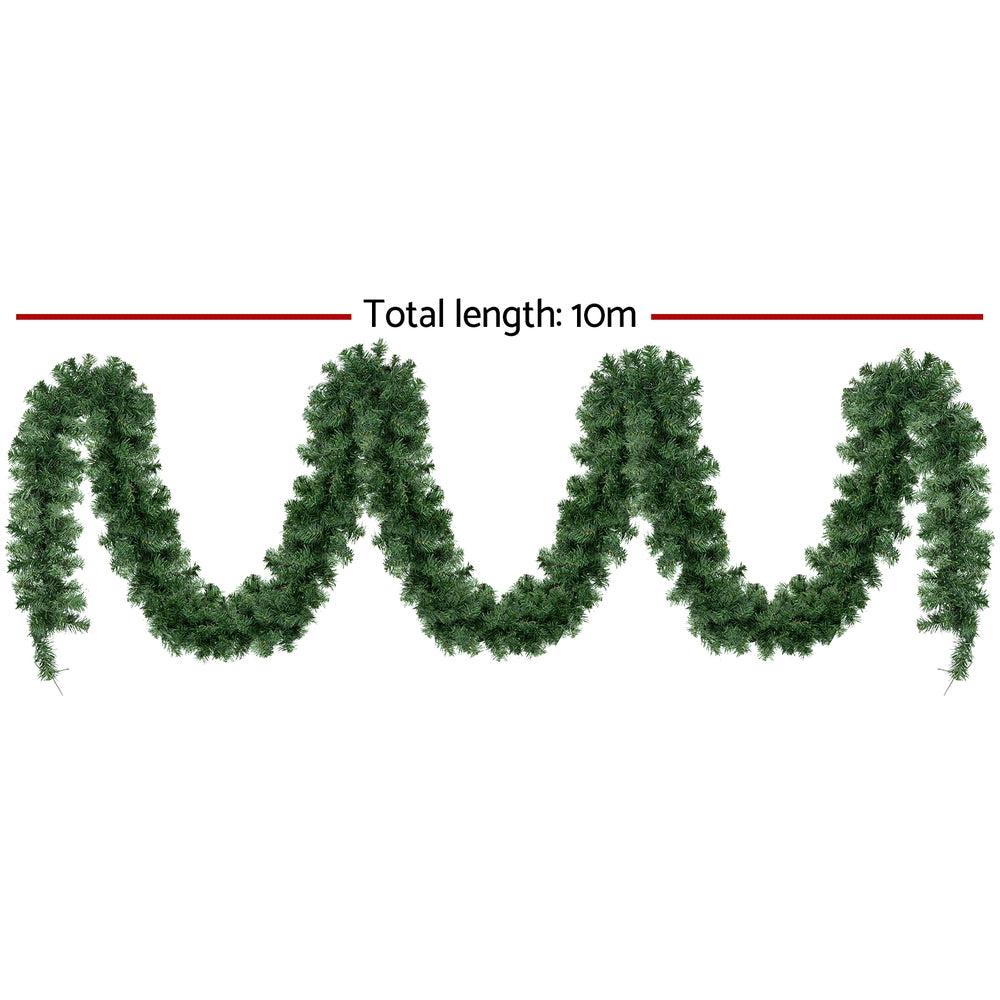 Green pine-tip pre-lit Christmas garland with warm LED lights, full length view