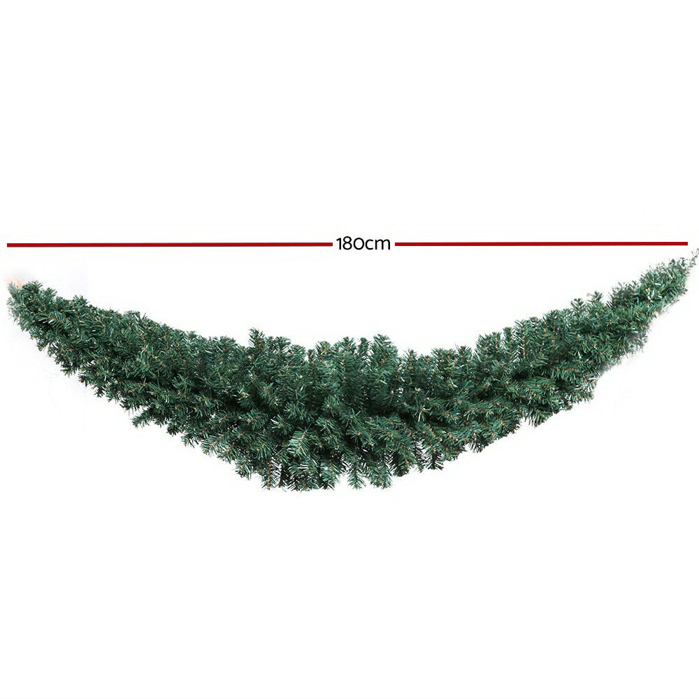 Green artificial Christmas garland with a measurement of 180cm on a white background