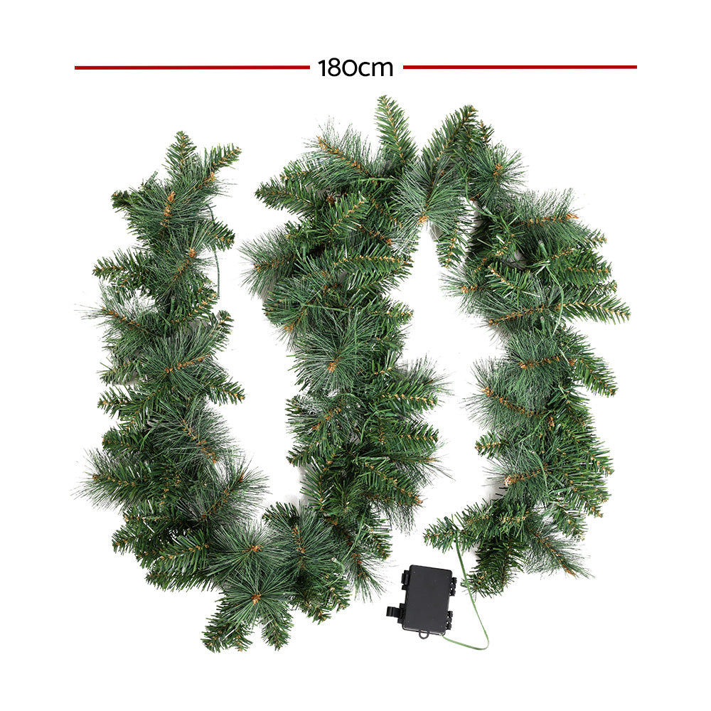 Green LED Christmas garland with warm lights and attached power box