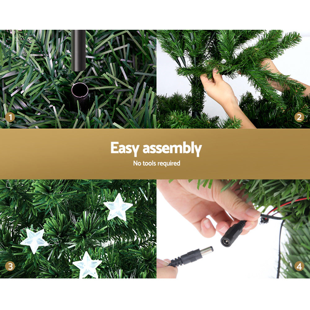 Hand assembling Christmas tree branches with star topper and LED cable.