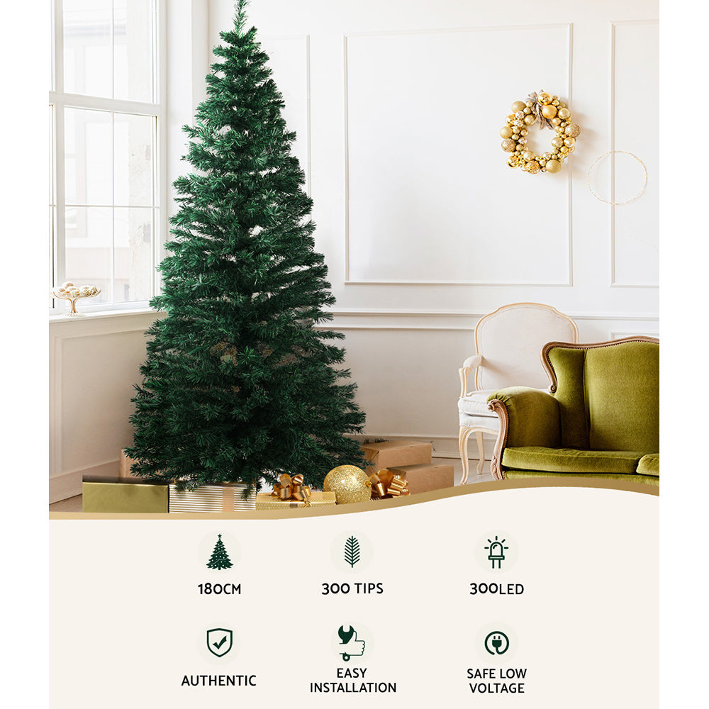 Artificial Christmas tree with warm white optic-fibre LED lights, 300 tip strands.
