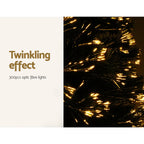Optic-fibre LED branches with warm twinkling light effect on artificial tree.