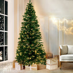 Full artificial Christmas tree with warm white optic-fibre LED lights, conical silhouette.