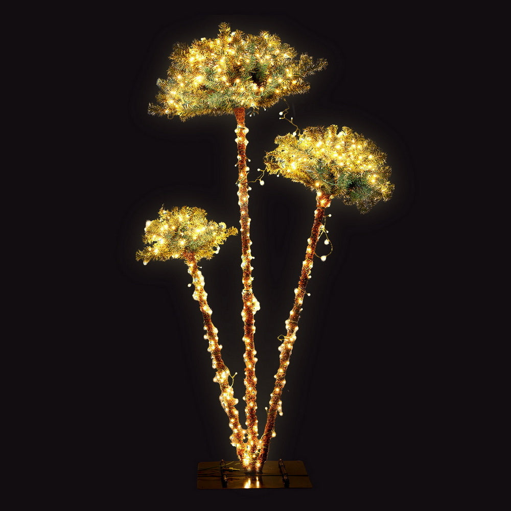 Illuminated LED palm tree decoration with three glowing canopies and warm lights
