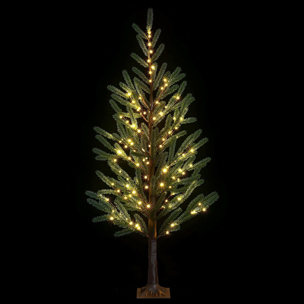 Pre-lit artificial Christmas tree with warm white LED lights and green foliage