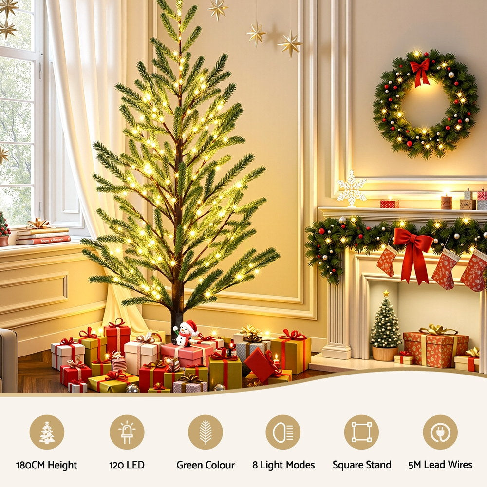 Pre-lit artificial Christmas tree with warm white LED lights on green branches