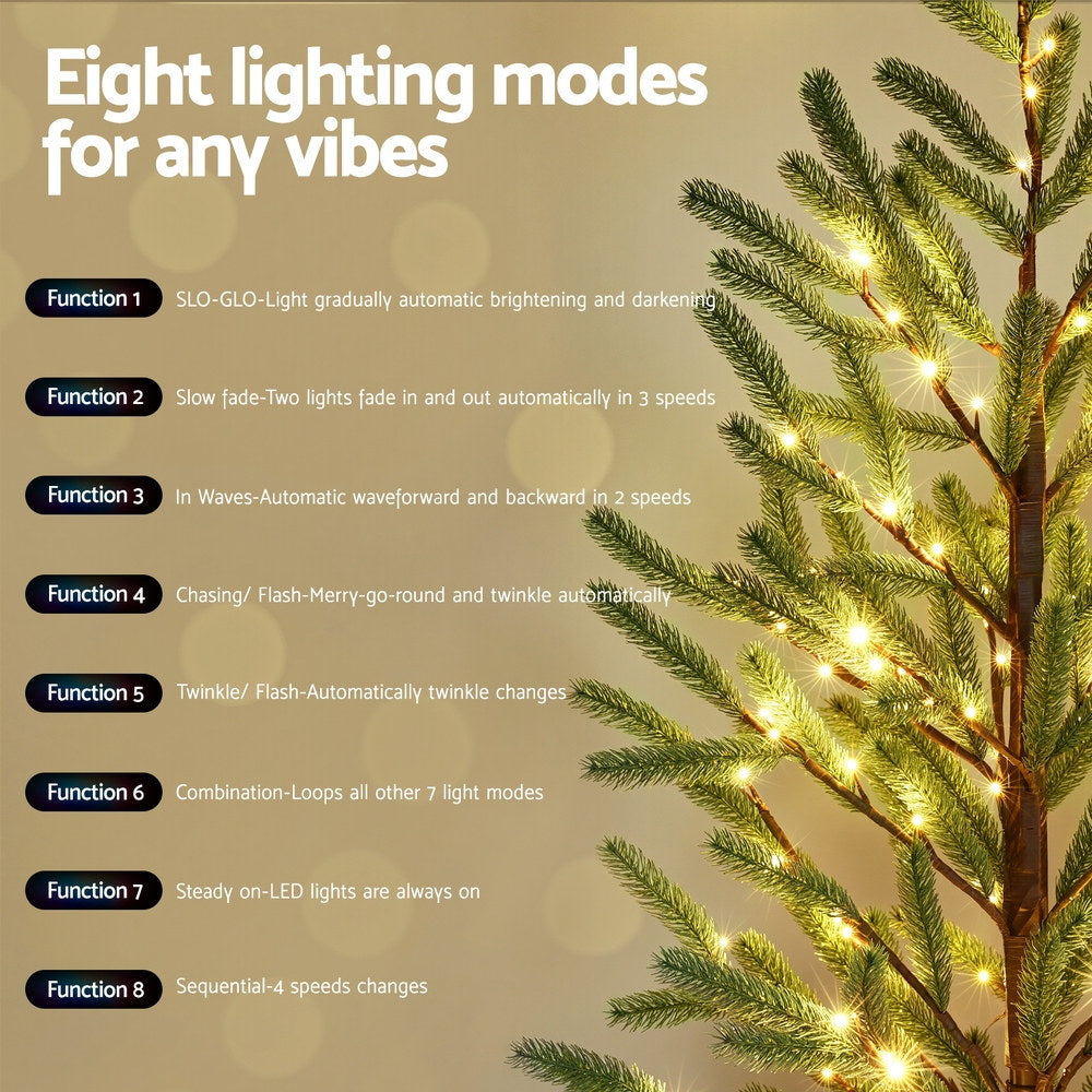 Pre-lit artificial Christmas tree with warm white LED lights along green branch tips