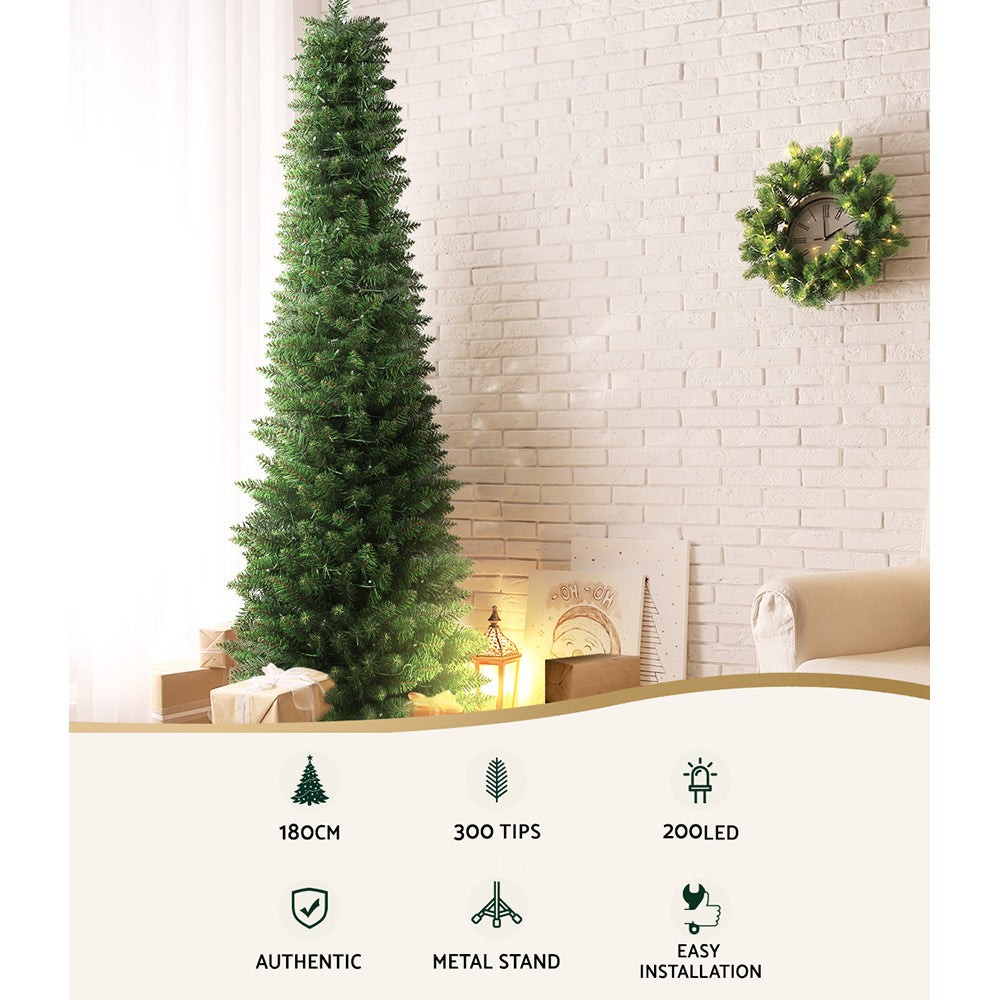 Pre-lit artificial Christmas tree with warm LED lights and metal stand
