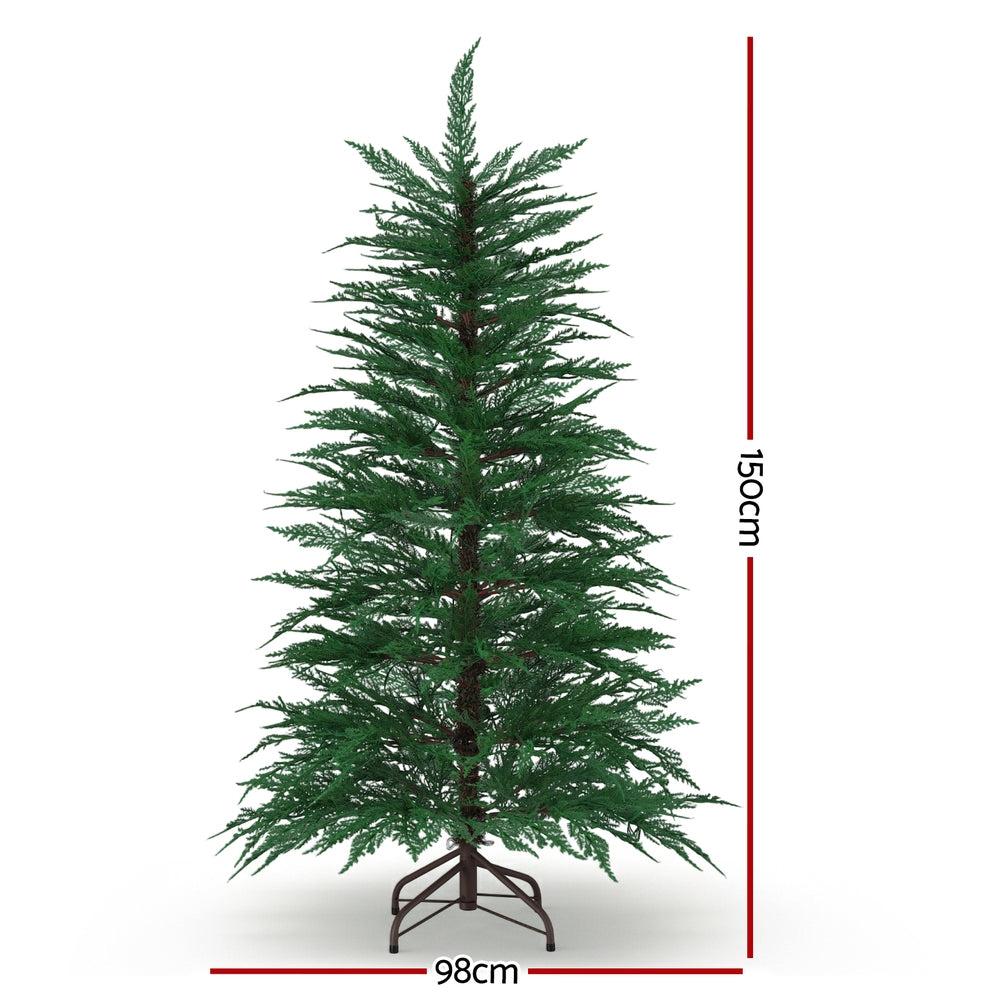 Pre-lit sparse Christmas tree, front view, warm white LED lights, metal stand