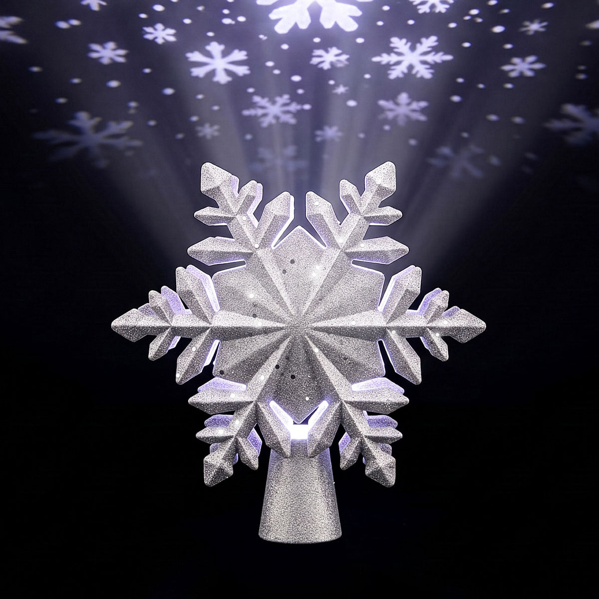 Silver snowflake tree topper with glitter finish and faceted arms