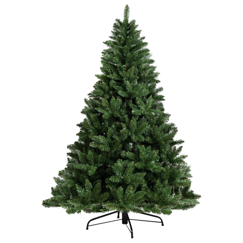 Green artificial Christmas tree on a white background
