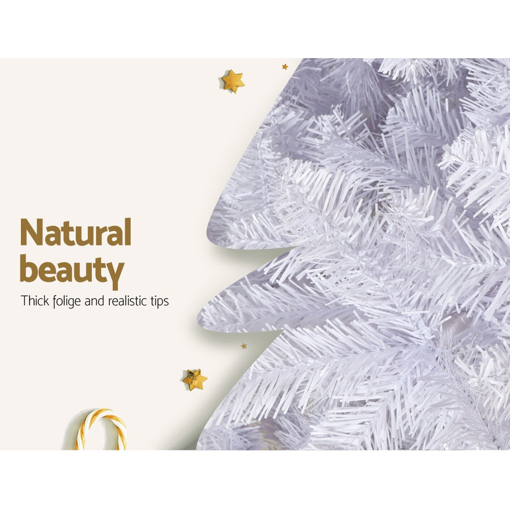 Close-up of white-tipped artificial Christmas tree foliage with thick, realistic tips.