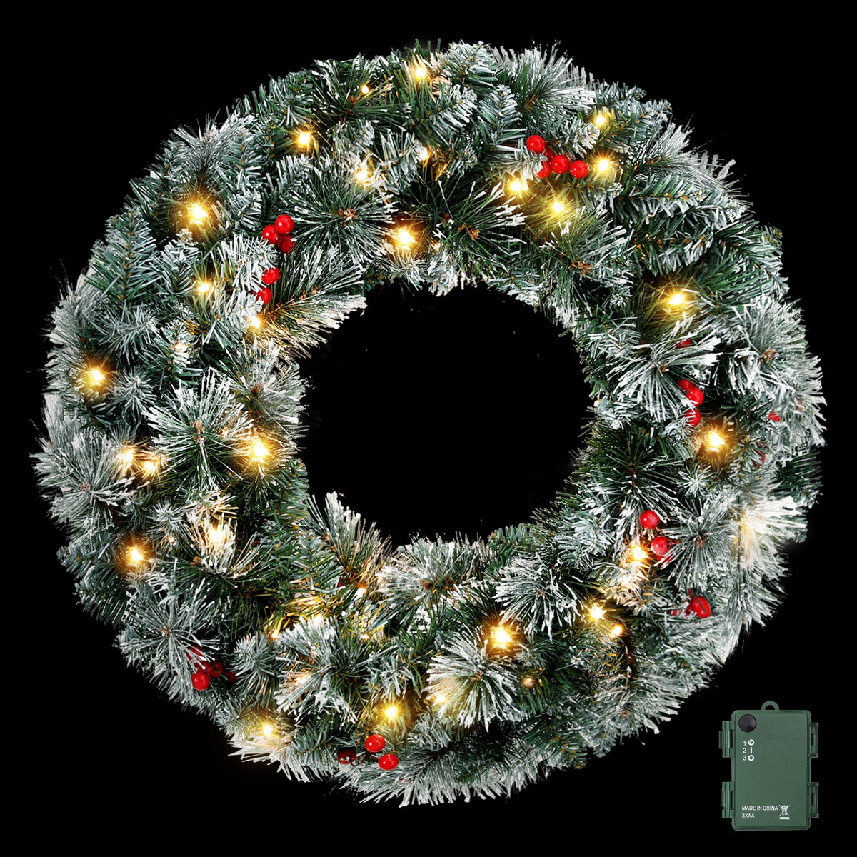 Flocked pine Christmas wreath with warm white LED lights and red berry accents