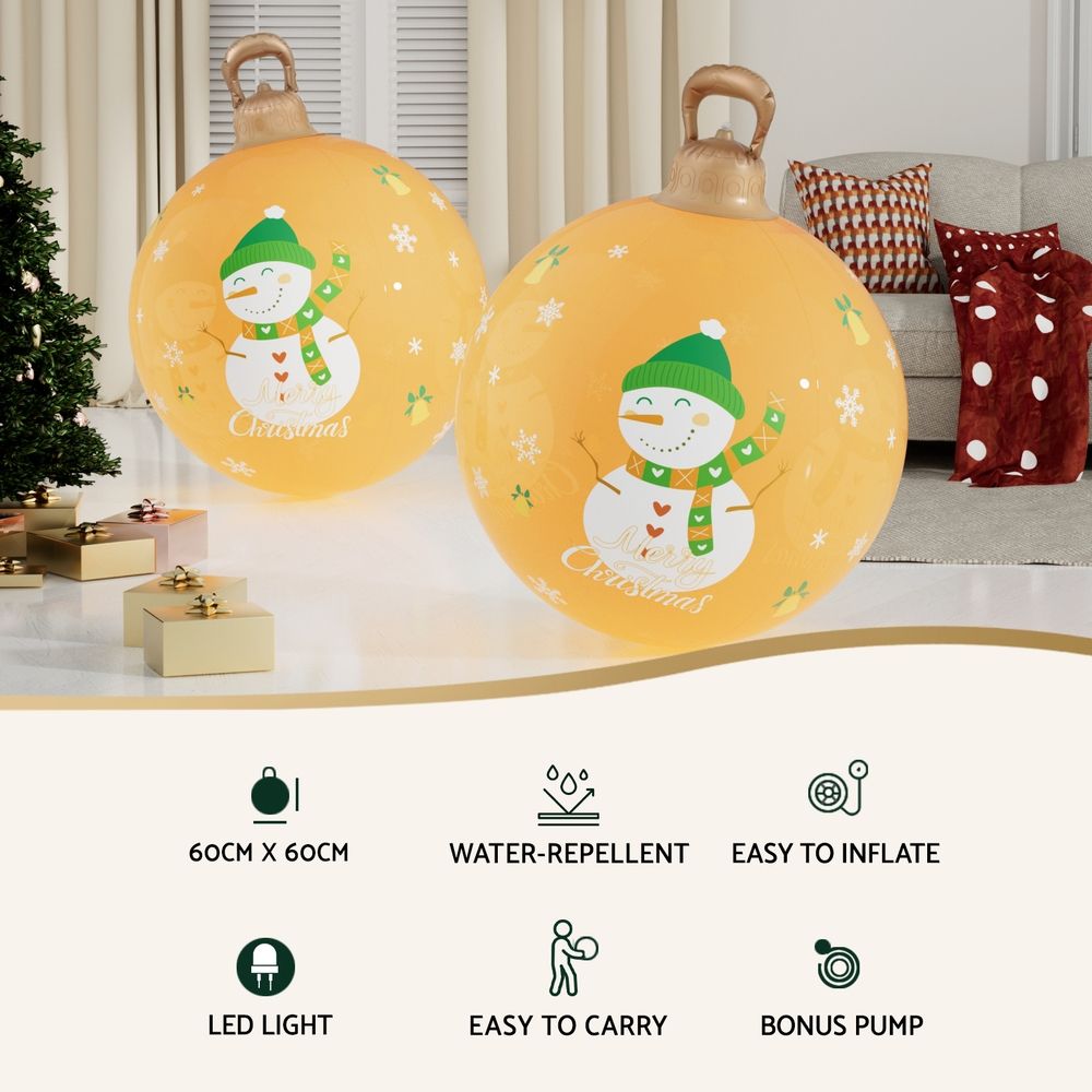 Two gold inflatable Christmas balls with snowman and 'Merry Christmas' prints